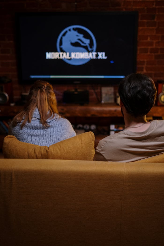Offerings Relaxing at home, a couple enjoys gaming in their cozy living room.